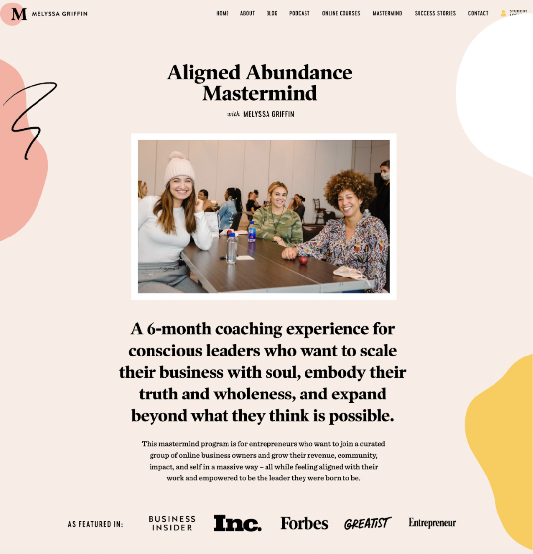 Aligned Abundance Mastermind with an image of a group of women sitting at a desk and smiling